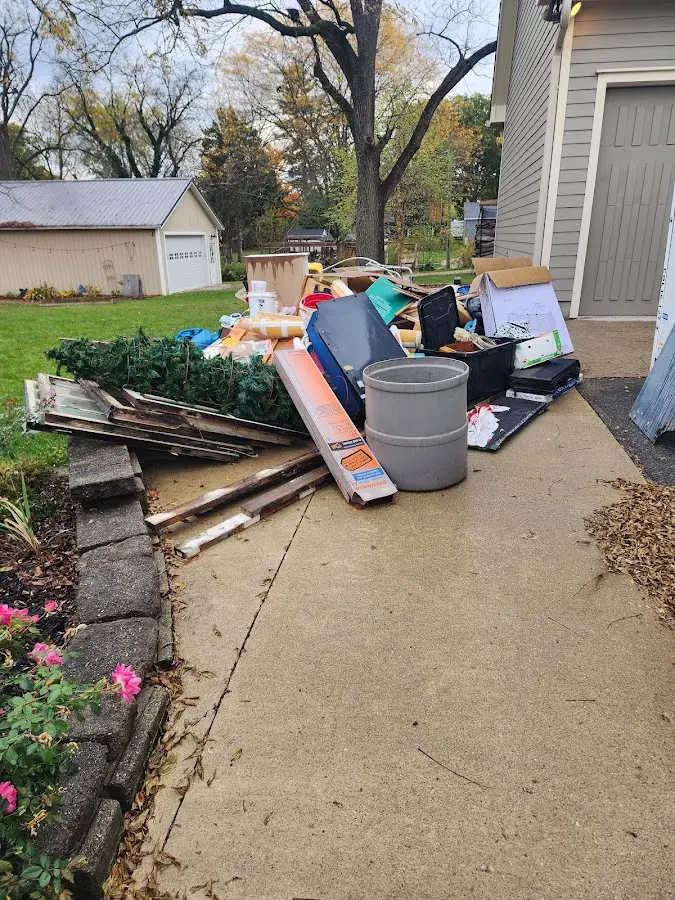 Dumpster being loaded with debris for 30 Yard Dumpster Rental in Rossmoor